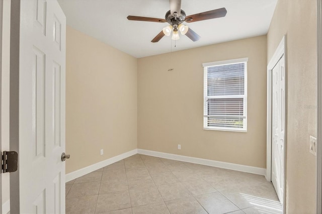 unfurnished bedroom featuring ceiling fan and light tile patterned floors