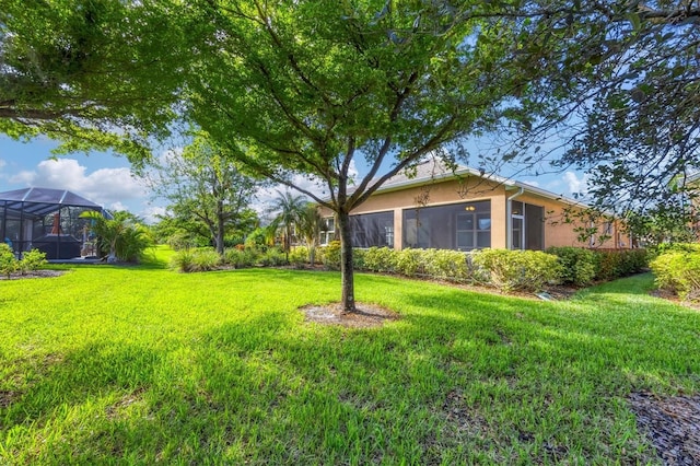 view of yard with a lanai