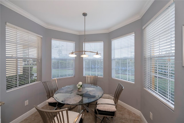 dining area with tile patterned floors and crown molding