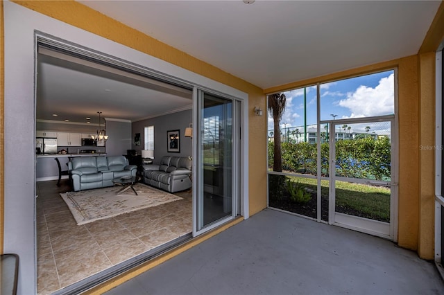 unfurnished sunroom with a notable chandelier