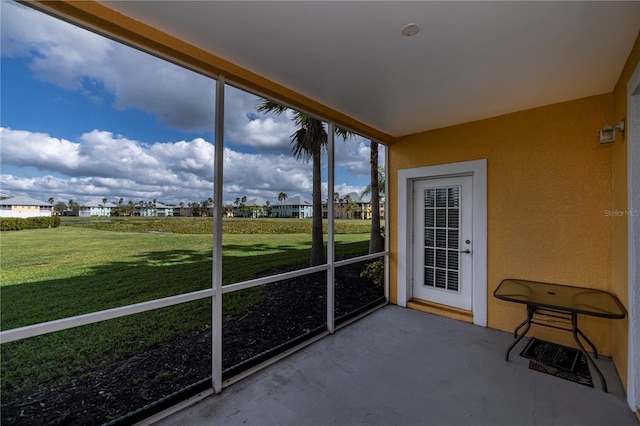 unfurnished sunroom featuring a healthy amount of sunlight