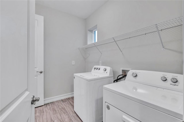 washroom featuring light wood-type flooring and independent washer and dryer