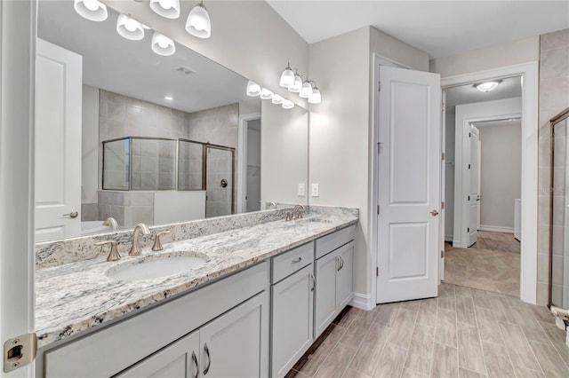 bathroom featuring vanity and walk in shower