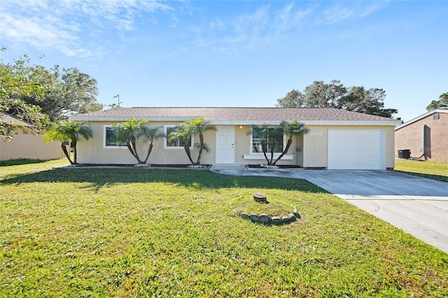 ranch-style house with a garage and a front lawn