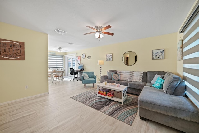 living room featuring ceiling fan