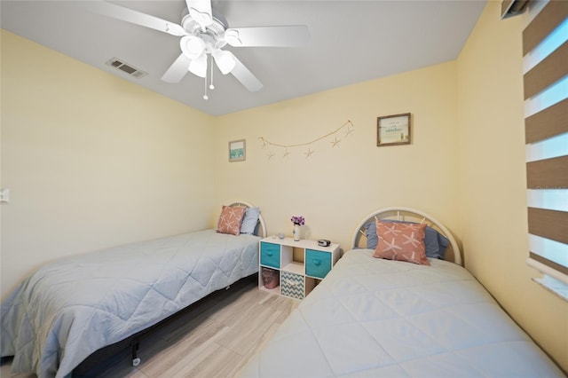 bedroom featuring ceiling fan and light hardwood / wood-style floors