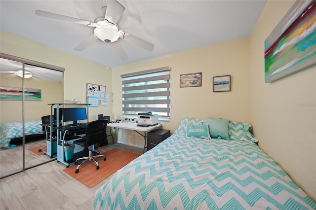 bedroom with ceiling fan and a closet