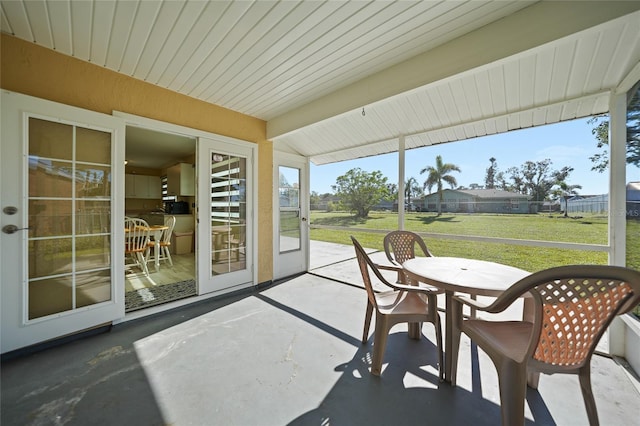 sunroom with beam ceiling