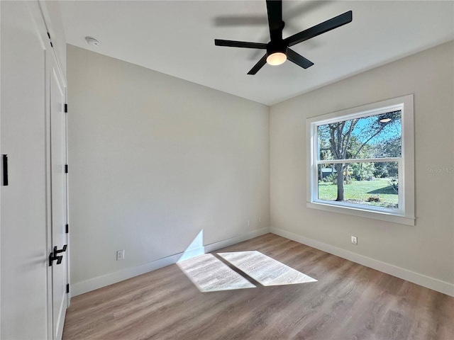 empty room with light hardwood / wood-style floors and ceiling fan