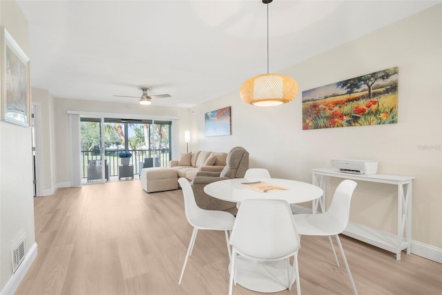 dining room featuring ceiling fan and light hardwood / wood-style flooring