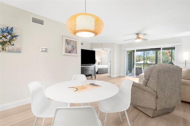 dining space featuring light hardwood / wood-style floors and ceiling fan