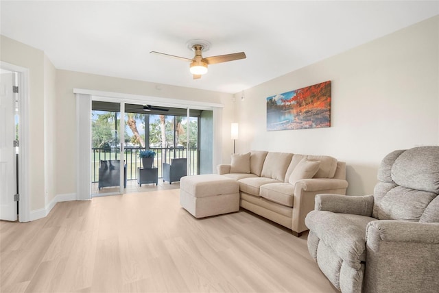 living room with ceiling fan and light hardwood / wood-style floors