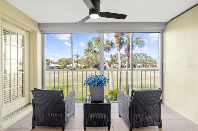 sunroom / solarium with plenty of natural light and ceiling fan