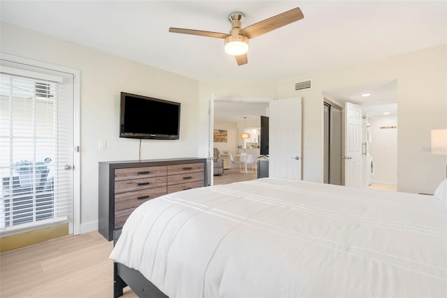 bedroom featuring ceiling fan and light hardwood / wood-style floors