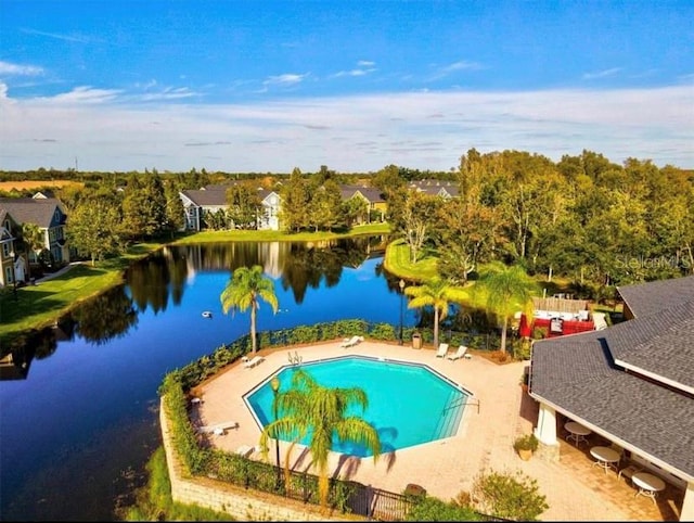 view of pool with a water view