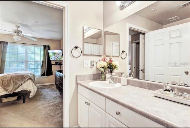 bathroom featuring vanity and ceiling fan