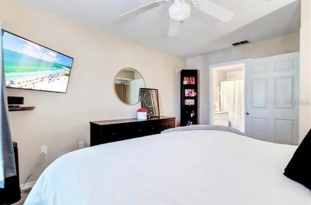 bedroom featuring ensuite bath and ceiling fan