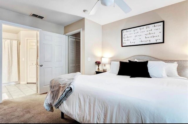 carpeted bedroom featuring a closet and ceiling fan