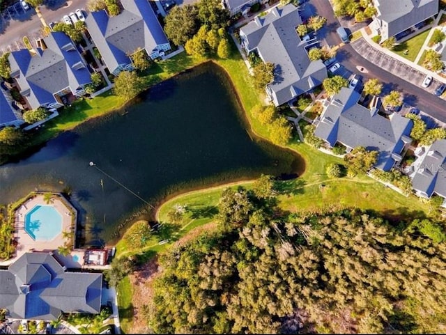 bird's eye view with a water view