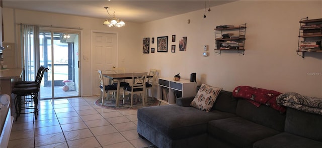 living room with light tile patterned flooring and a chandelier