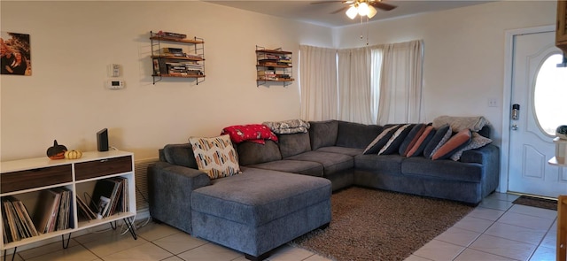 living room featuring ceiling fan and light tile patterned floors