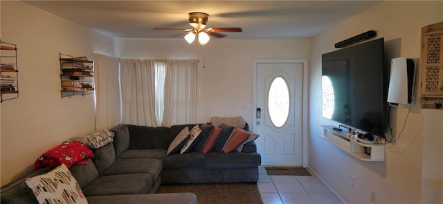 living room featuring light tile patterned floors and ceiling fan