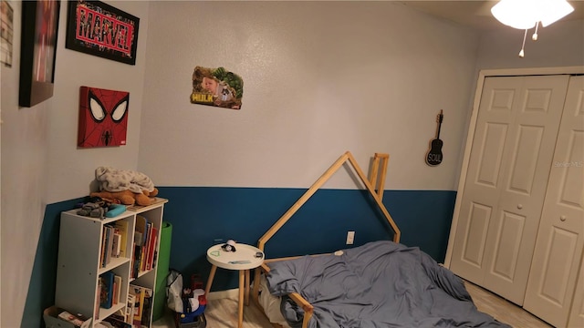 bedroom with hardwood / wood-style flooring and a closet