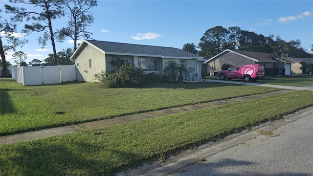 single story home with a front yard