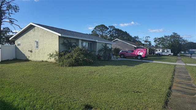 ranch-style house featuring a front lawn