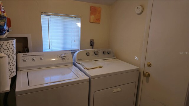 laundry room with washing machine and clothes dryer