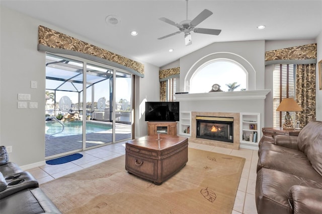 tiled living room with vaulted ceiling and ceiling fan