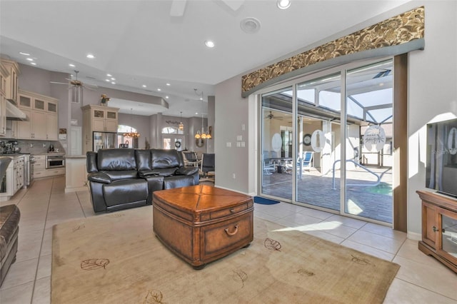 tiled living room featuring ceiling fan