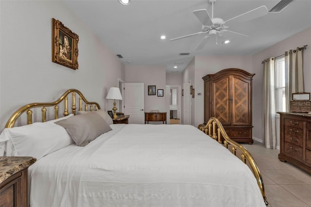 tiled bedroom featuring ceiling fan