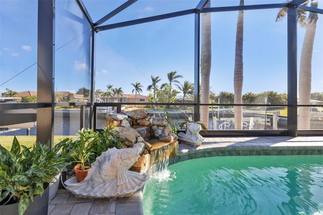 view of swimming pool with glass enclosure