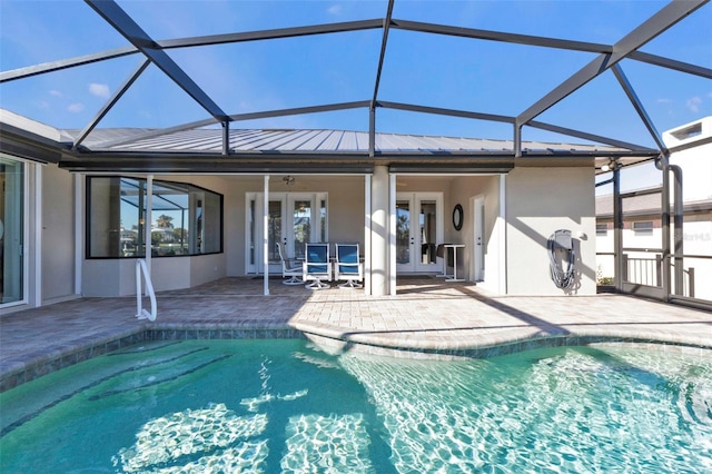 view of pool featuring a patio area, a lanai, and french doors