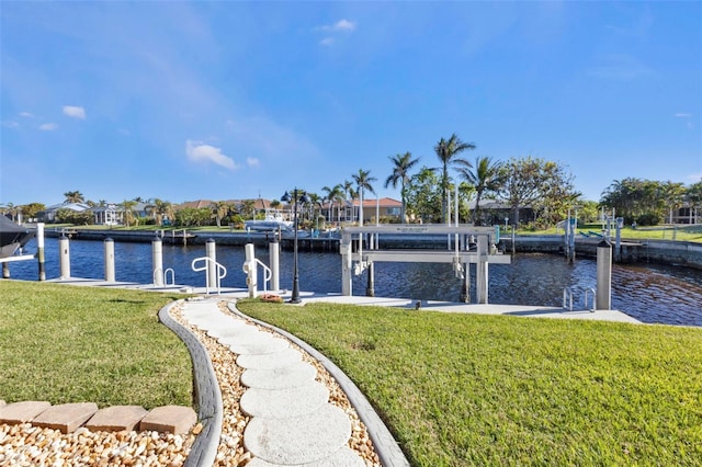 dock area featuring a water view and a yard