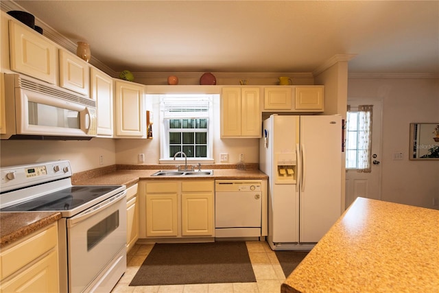 kitchen with white appliances, crown molding, and sink