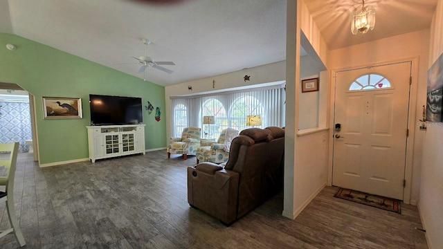 foyer entrance with ceiling fan, dark hardwood / wood-style flooring, and vaulted ceiling