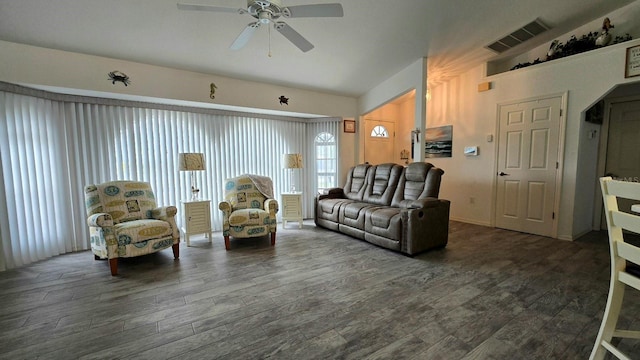 living room with ceiling fan and dark hardwood / wood-style flooring