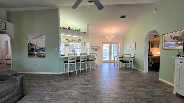 kitchen with french doors, ceiling fan, dark hardwood / wood-style floors, white cabinetry, and lofted ceiling