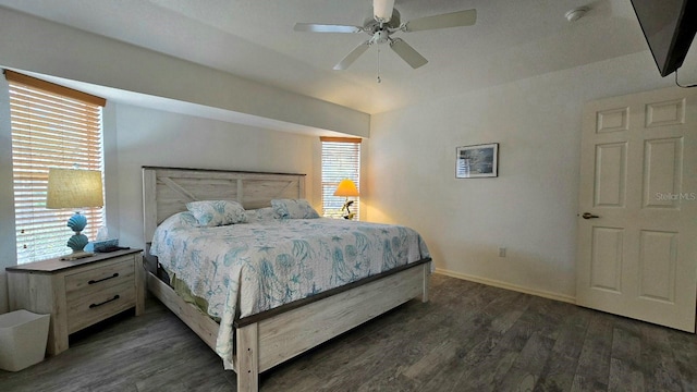 bedroom with ceiling fan and dark hardwood / wood-style flooring