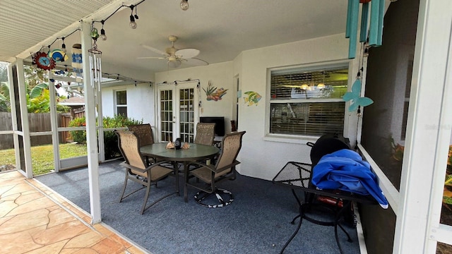 sunroom with ceiling fan and french doors