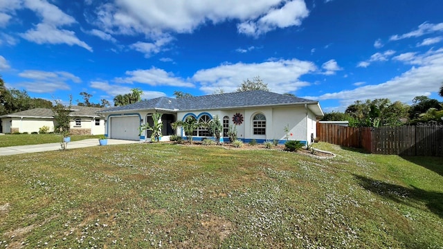 ranch-style home with a front lawn and a garage