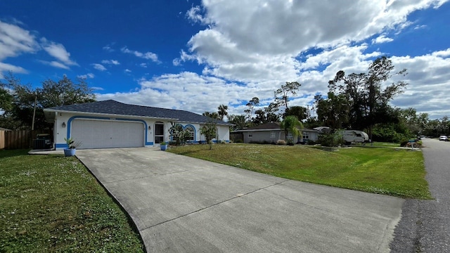 single story home with a garage and a front lawn