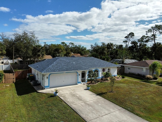 single story home with central AC unit, a garage, and a front lawn