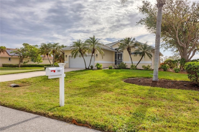 view of front facade with a front yard and a garage