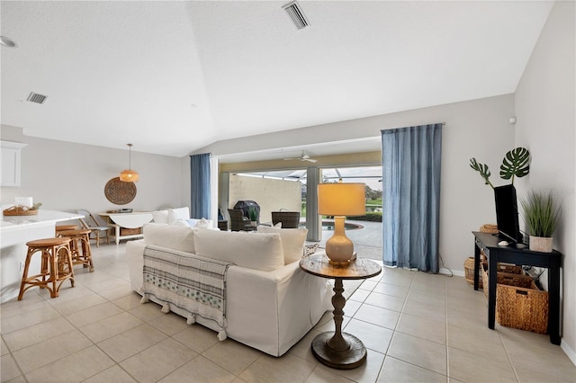 living room with light tile patterned floors and vaulted ceiling