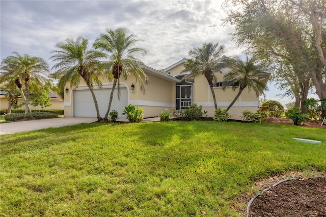 view of front of property with a front yard and a garage