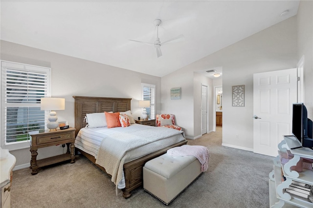 bedroom with multiple windows, ceiling fan, light carpet, and vaulted ceiling