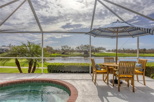 view of patio / terrace with a water view, a lanai, and a swimming pool